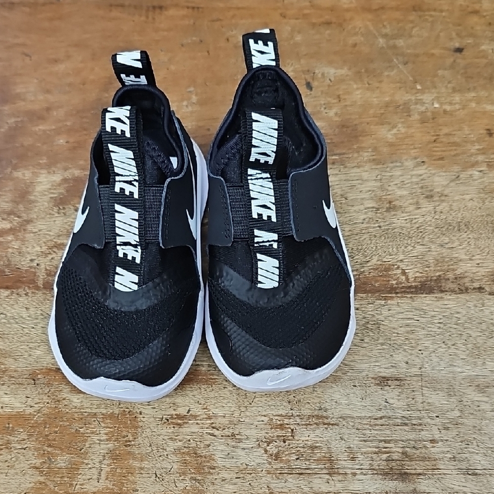 Kids Nike Black and White Streamlined Slip-On Sneakers